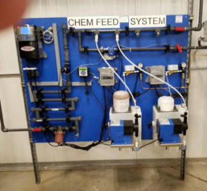 Solid feed cooling tower system